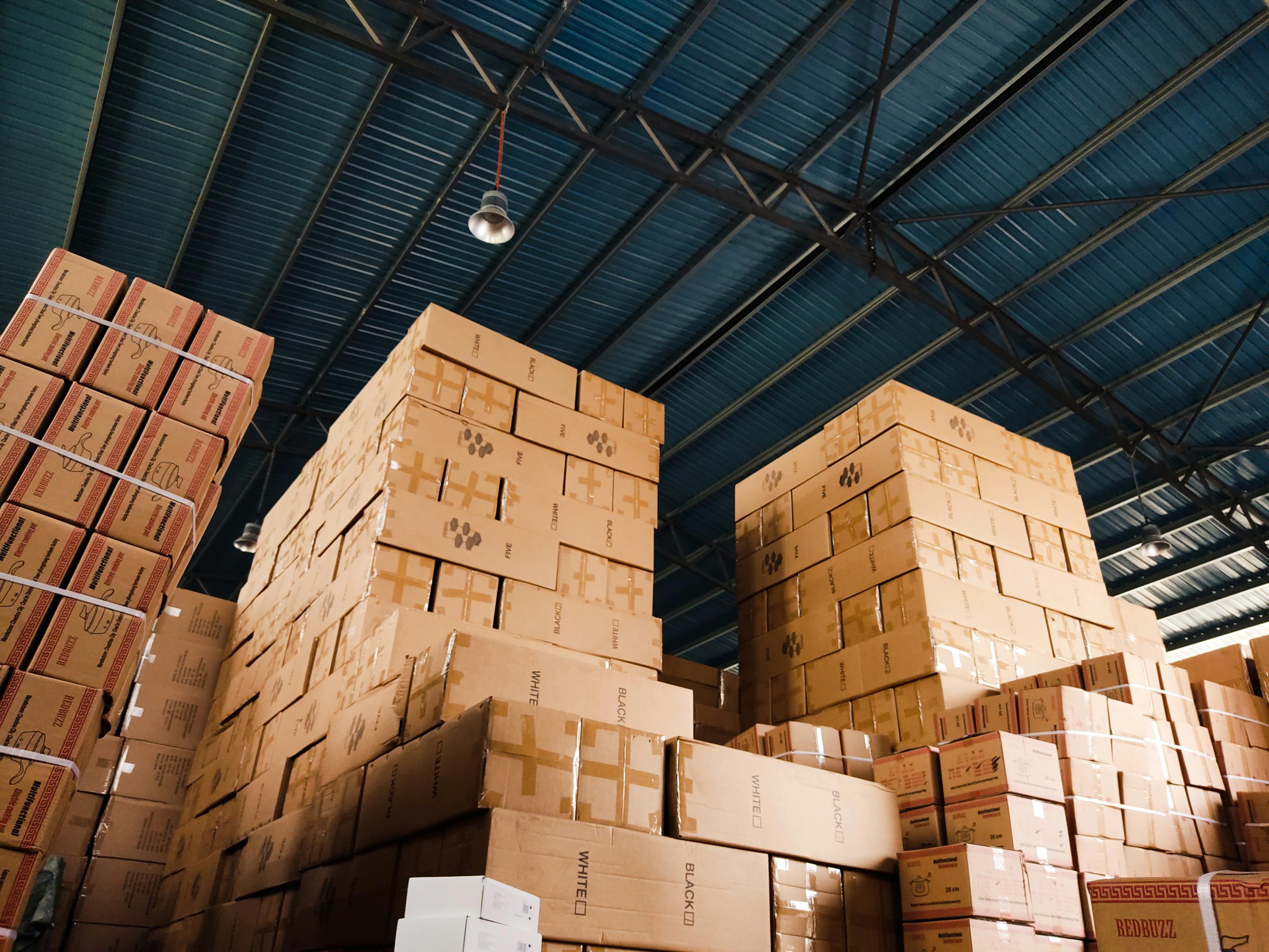 Stacked warehouse boxes for tracking FedEx and UPS tariff refund records
